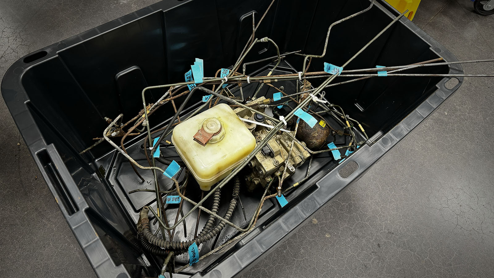 Brake system components in storage tote bin