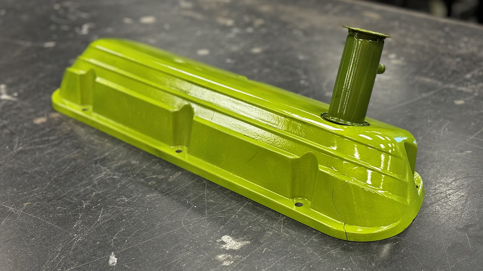 Powder coated valve cover in transparent green